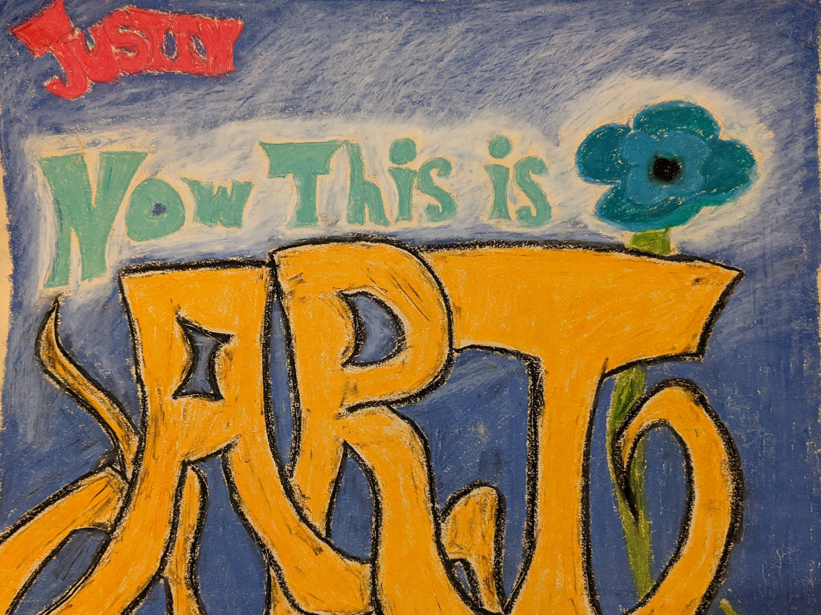 Colorful drawing with the name "Justin" at the top, followed by the phrase "Now This Is Art."
