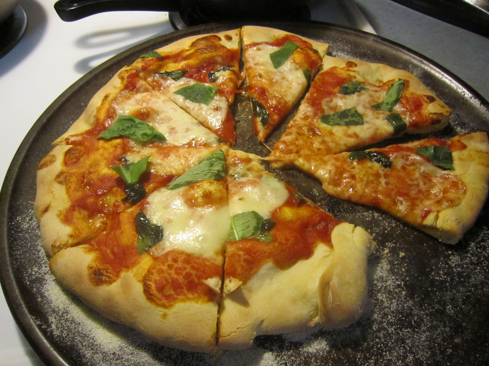 Photo of sliced Pizza Margherita
