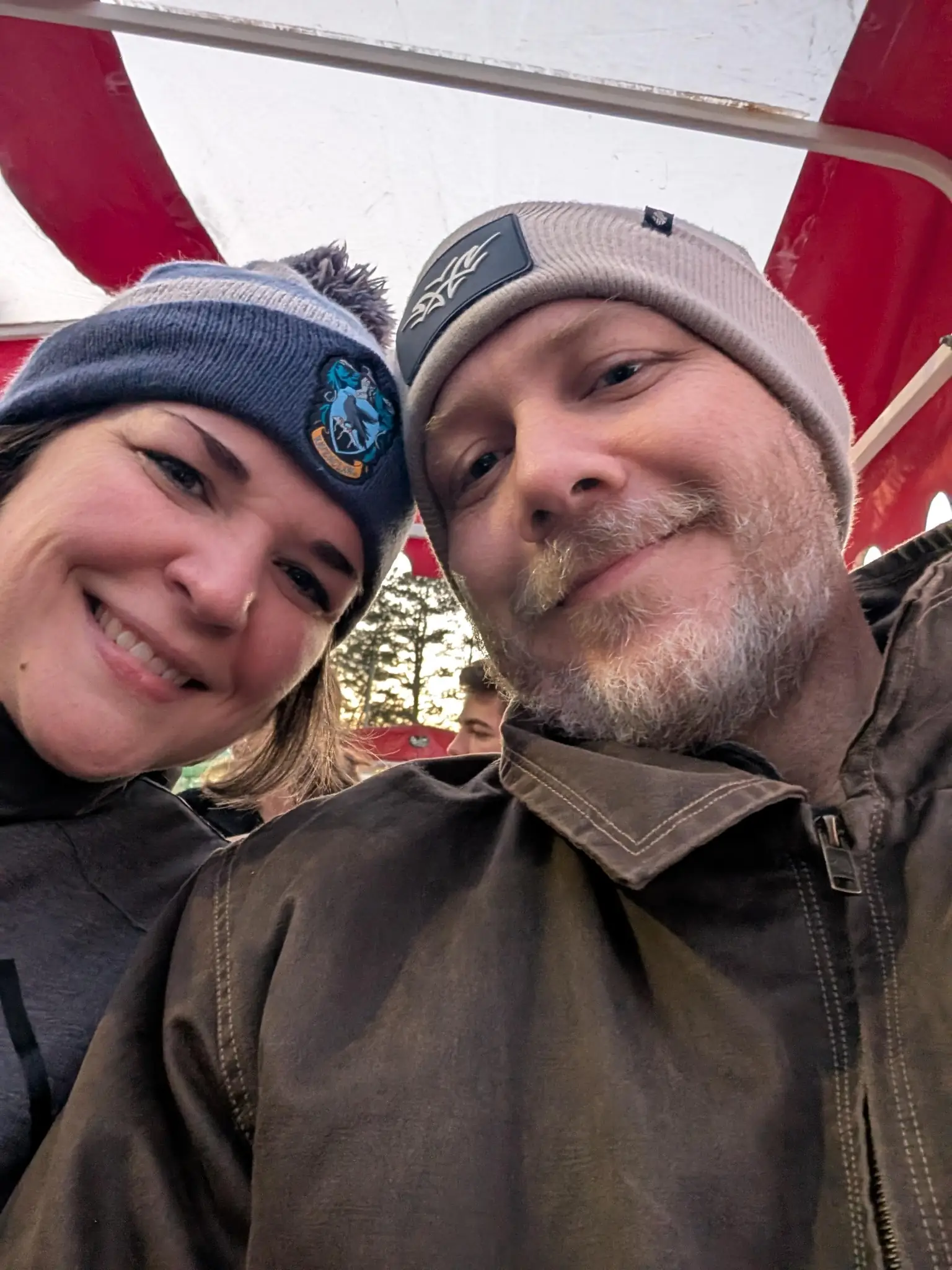 Ashley and Justin sitting in a trolley.