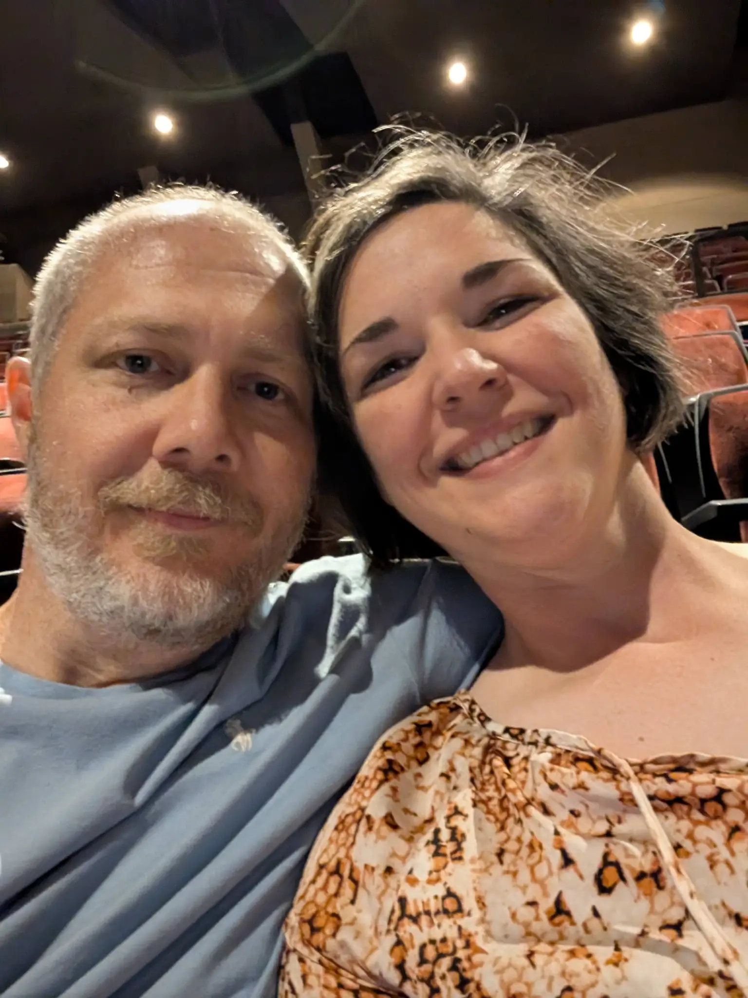 Ashley and Justin sitting in the theater at the Alabama Shakespeare Festival.